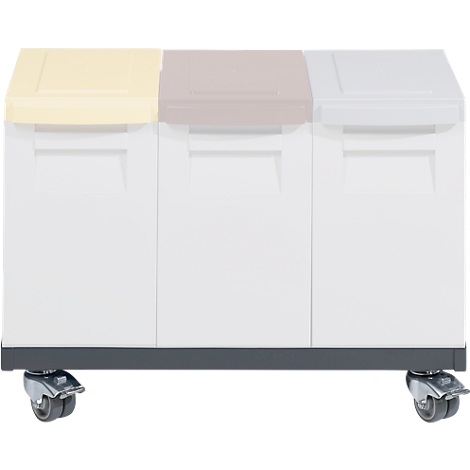 Waste separation system with three containers and wheels. Lids: Yellow, pink, grey.