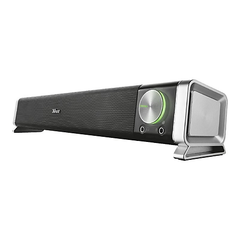 Schwarze Trust Soundbar mit großem Lautstärkeregler und grüner LED-Beleuchtung auf weißem Hintergrund.
