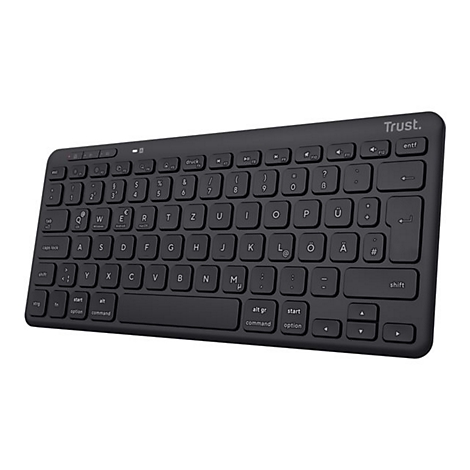 Schwarze kabellose Trust Tastatur im deutschen Layout vor weißem Hintergrund.