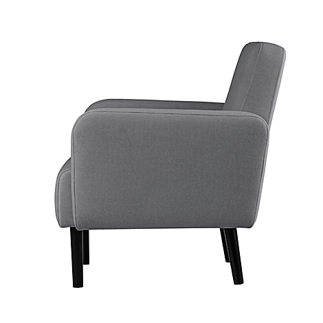 Grijze fauteuil met zwarte poten, zijaanzicht.