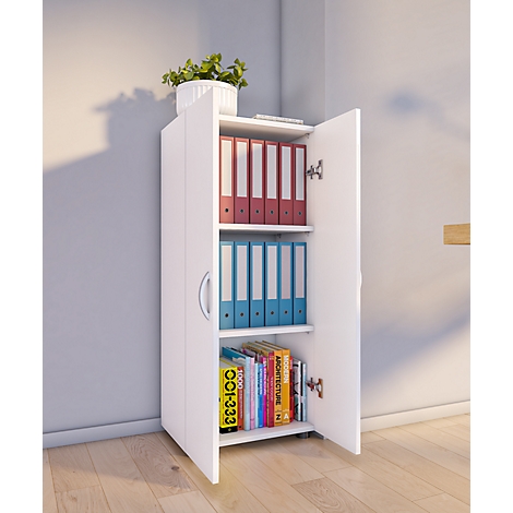 White filing cabinet with open doors, filled with folders and books. There is a potted plant on top.