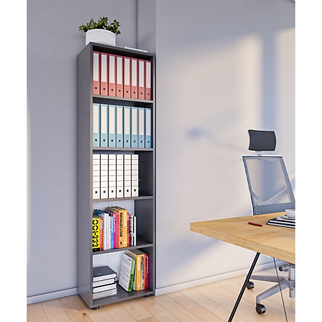 Gray shelf filled with binders, books and a potted plant. A desk and office chair can be seen in the background.