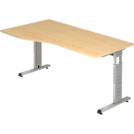 A height-adjustable desk made of light-colored wood with a silver frame. The tabletop is curved.