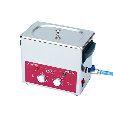 Stainless steel ultrasonic cleaner with red control panel, two knobs, and the inscription "EMAG".