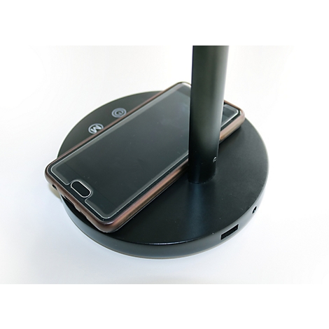 Schwarzer Leuchtenfuß mit integrierter kabelloser Smartphone-Ladestation.