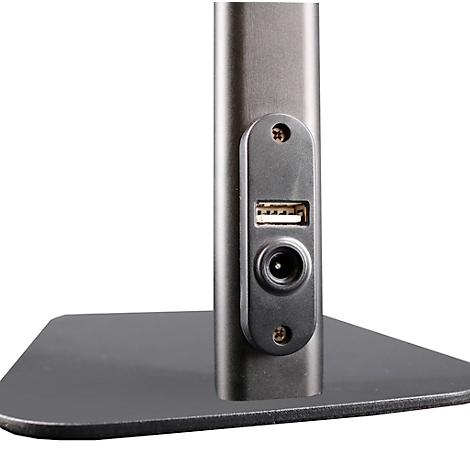 Gedetailleerde close-up van de achterkant van een monitor met USB- en voedingsconnectoren.