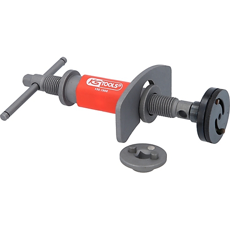 Ein Werkzeug mit Handkurbel und rotem Griff, grauem Metallrahmen und -scheibe, abnehmbarem Aufsatz. Auf dem Griff steht 'KS TOOLS'.