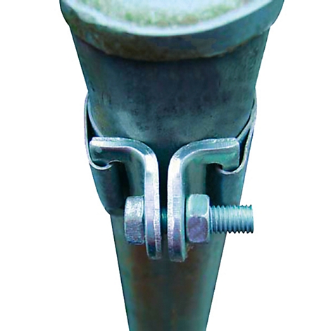 Close-up of a metal pipe clamp. It connects two pipes with a screw and nut.