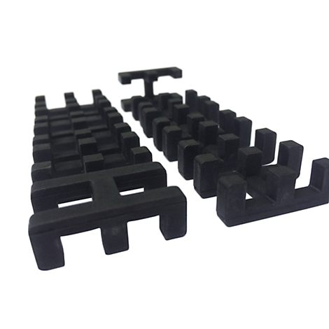 Black, geometric components. Geometric shapes form a grid-like structure. The components are placed in front of a white background.