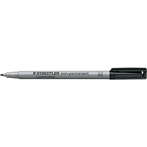A black pen, Staedtler Lumocolor non-permanent, lies horizontally.