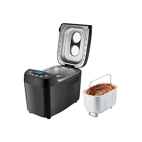 Schwarzer Brotbackautomat mit geöffnetem Deckel und herausgenommener Backform mit fertigem Brot daneben.