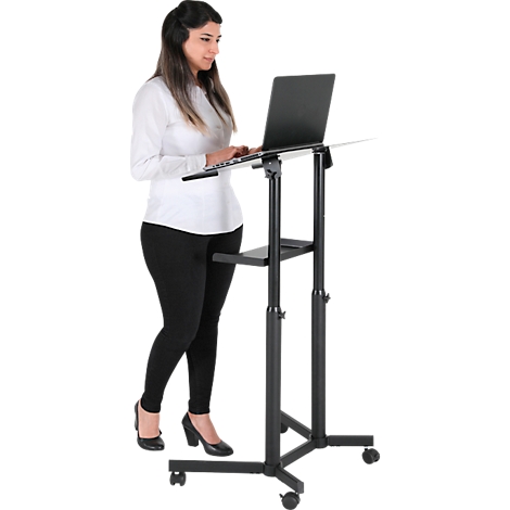 A woman stands at an adjustable height laptop desk, typing. The desk is black, the woman is wearing black and white.