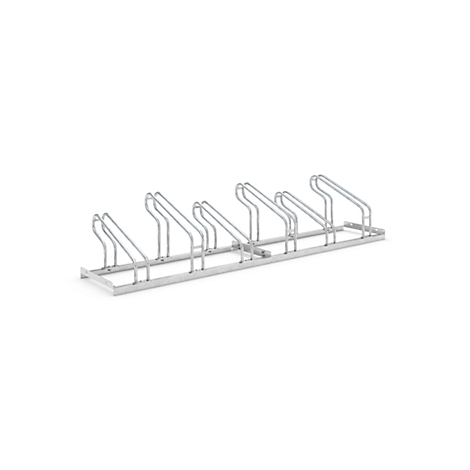 Silver metal bicycle rack on a white background.