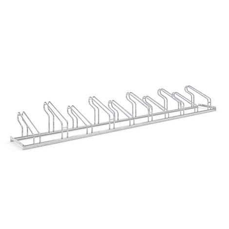 Metal wire bicycle rack against a white background. The rack has space for several bikes.
