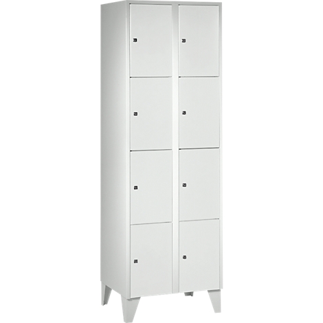 White cabinet with eight doors and small knobs on the doors, standing on four feet.