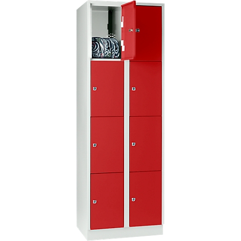 A white locker with red doors. One door is open, revealing a bag inside.