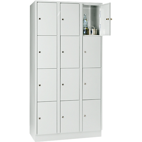 White locker with 12 compartments, one door open, bottle and can.