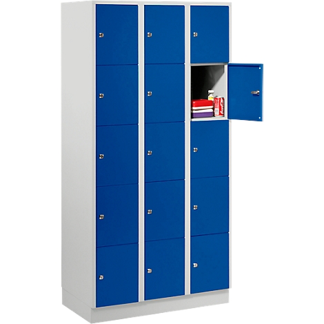 Blue and white locker with open door; books and drinks inside.
