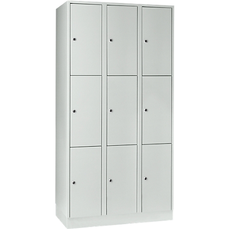 A white locker with nine compartments and small black handles.