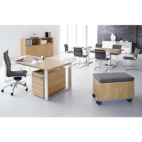 An office with wooden furniture, desk, chairs, and a meeting table. Bright atmosphere, white floor, grey chairs.