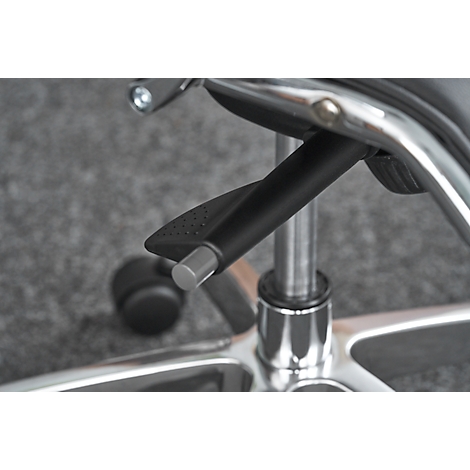Close-up of a black, curved lever on a chrome office chair, likely used to adjust the height.