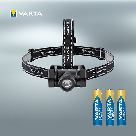 Black headlamp with VARTA logo and batteries on a gray background. The product is shown in detail.