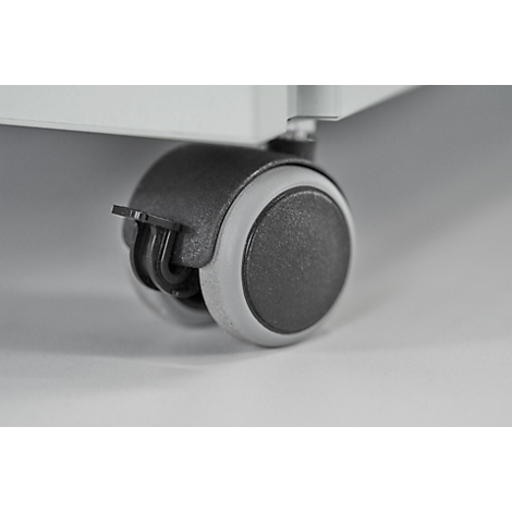 Close-up van een grijs en zwart meubelwiel. Het wiel is bevestigd aan een meubelstuk.