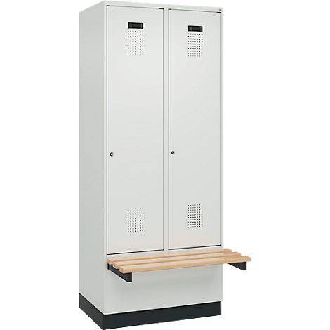 Casier blanc avec deux portes et motifs perforés, un banc et une base noire.