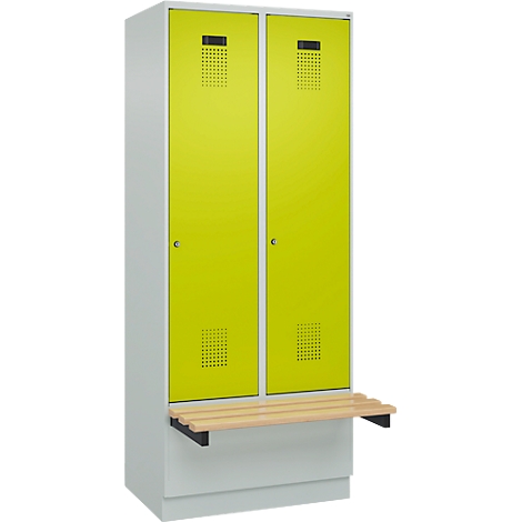 Armoire gris-blanc avec deux portes jaune néon, un banc et des trous.