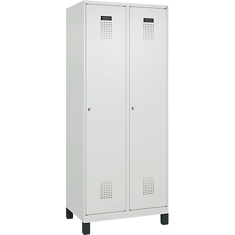 Armoire double blanche à deux portes, aérations rectangulaires et pieds noirs.