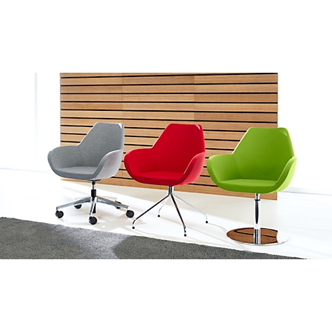 Three office chairs in grey, red and green in front of wooden slats.