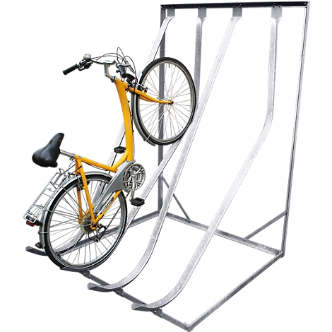 Yellow bicycle in a metal bike rack. The rack has curved rails that make parking easier.