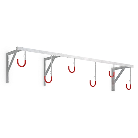 Bike rack on the wall, made of metal, with four red hooks.