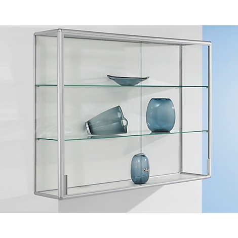 Wall-mounted display cabinet with glass shelves. Blue vases and bowls are on the shelves. The cabinet is attached to a white wall.