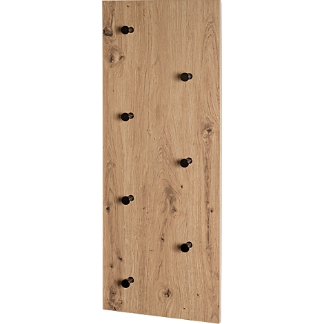 Holztafel mit schwarzen Knöpfen. Die Holzstruktur ist deutlich zu sehen.