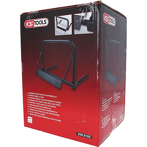 Schwarzer Papierhandtuchhalter auf roter Verpackung. Auf der Verpackung Logos und Produktbeschreibungen.