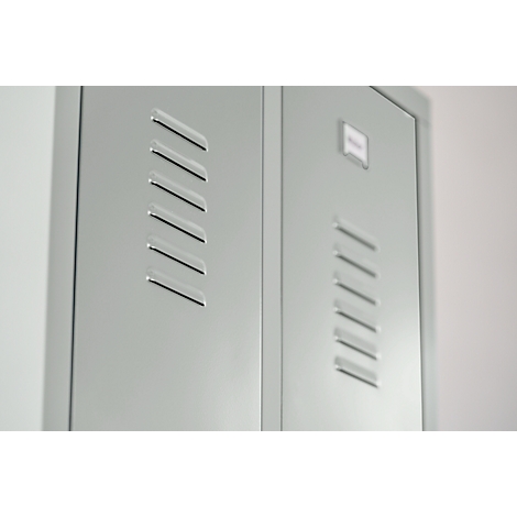 Light grey cabinet doors with angled ventilation slots, slightly out of focus.