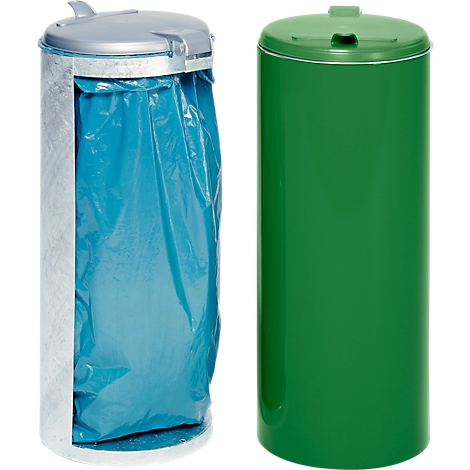 Two trash cans. On the left, an open silver bin with a blue trash bag. On the right, a green bin with a lid.