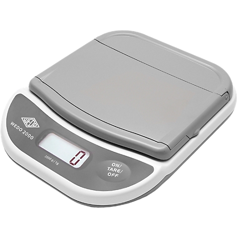 Digital scale with gray lid. Display shows 0. Control panel with 'ON/TARE/OFF'.
