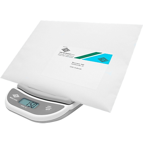 A white package sits on a gray scale showing 150. The package has a label on it.