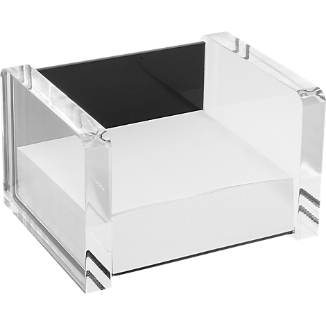 Square, transparent acrylic block with black plate on a white shelf. A design object with a minimalist aesthetic.