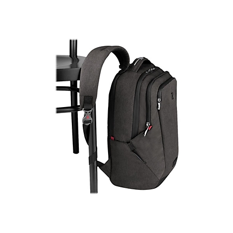 Dunkelgrauer Rucksack an einem schwarzen Tisch. Der Rucksack hat mehrere Fächer und Reißverschlüsse.