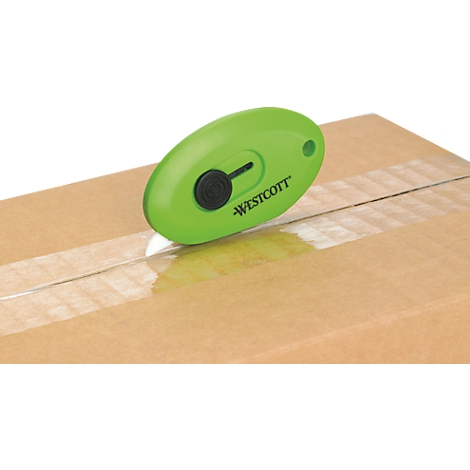 A green box cutter cutting tape on a cardboard box. The brand is Westcott.