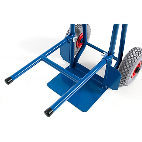 Blue hand truck, close-up: frame, wheels with red rim, loading area.