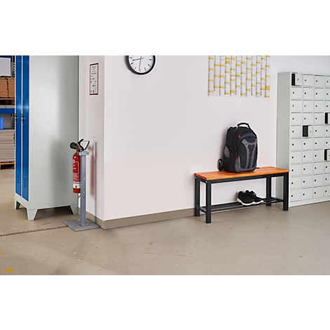 An interior shows lockers, a bench with backpack and shoes, a clock, and a fire extinguisher.