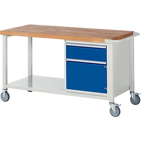 Work bench with wooden top, blue drawers and wheels.