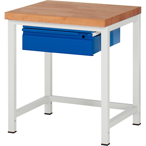 A small work table with wooden top, white frame and blue drawer.