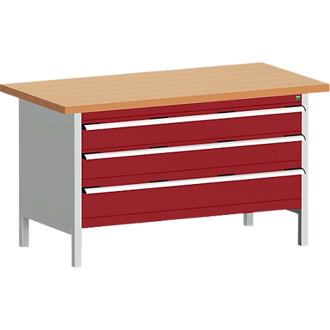 Workbench with wooden top, three red drawers and silver handles. Metal legs.