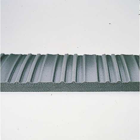 Close-up of a gray, ribbed foam board. The ribs run parallel.