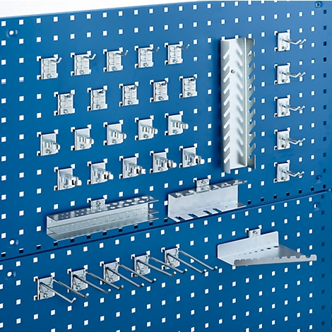 Blue pegboard with tool holders and hooks, for tool storage.